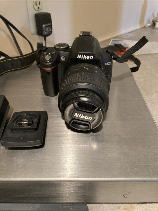 Nikon D3000 Digital Camera And 18-55 mm Lens With Strap Charger And Tripod Mount